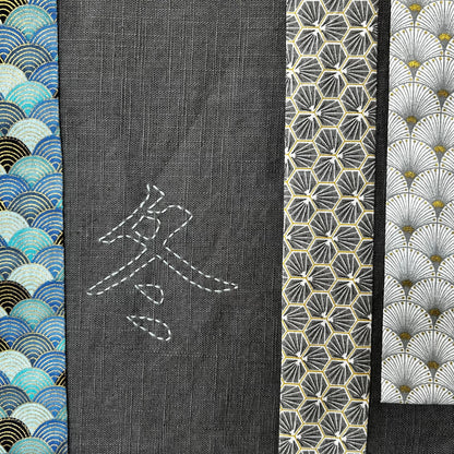 Détail appliqués tissu et broderie sur tenture