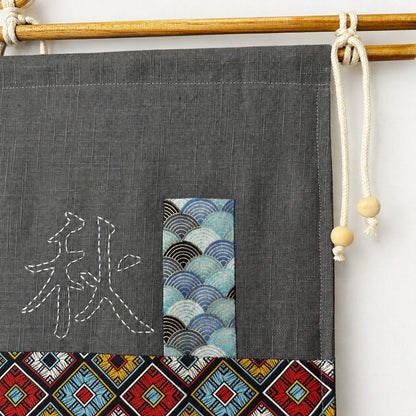 Détail appliqués tissu et broderie sur tenture