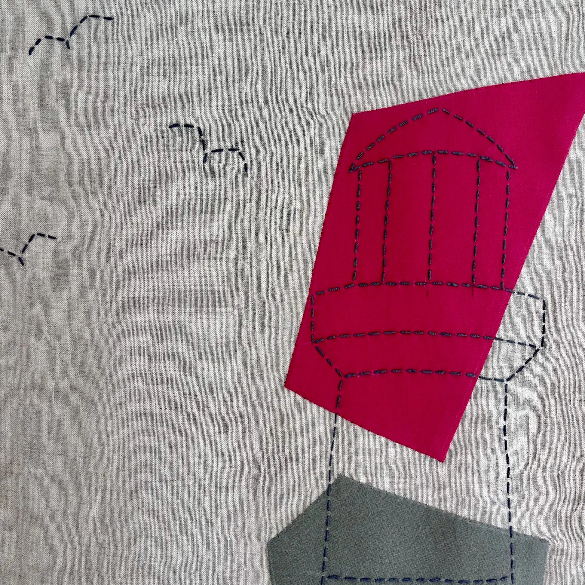 détail motif phare sur tenture appliqué coton et broderie